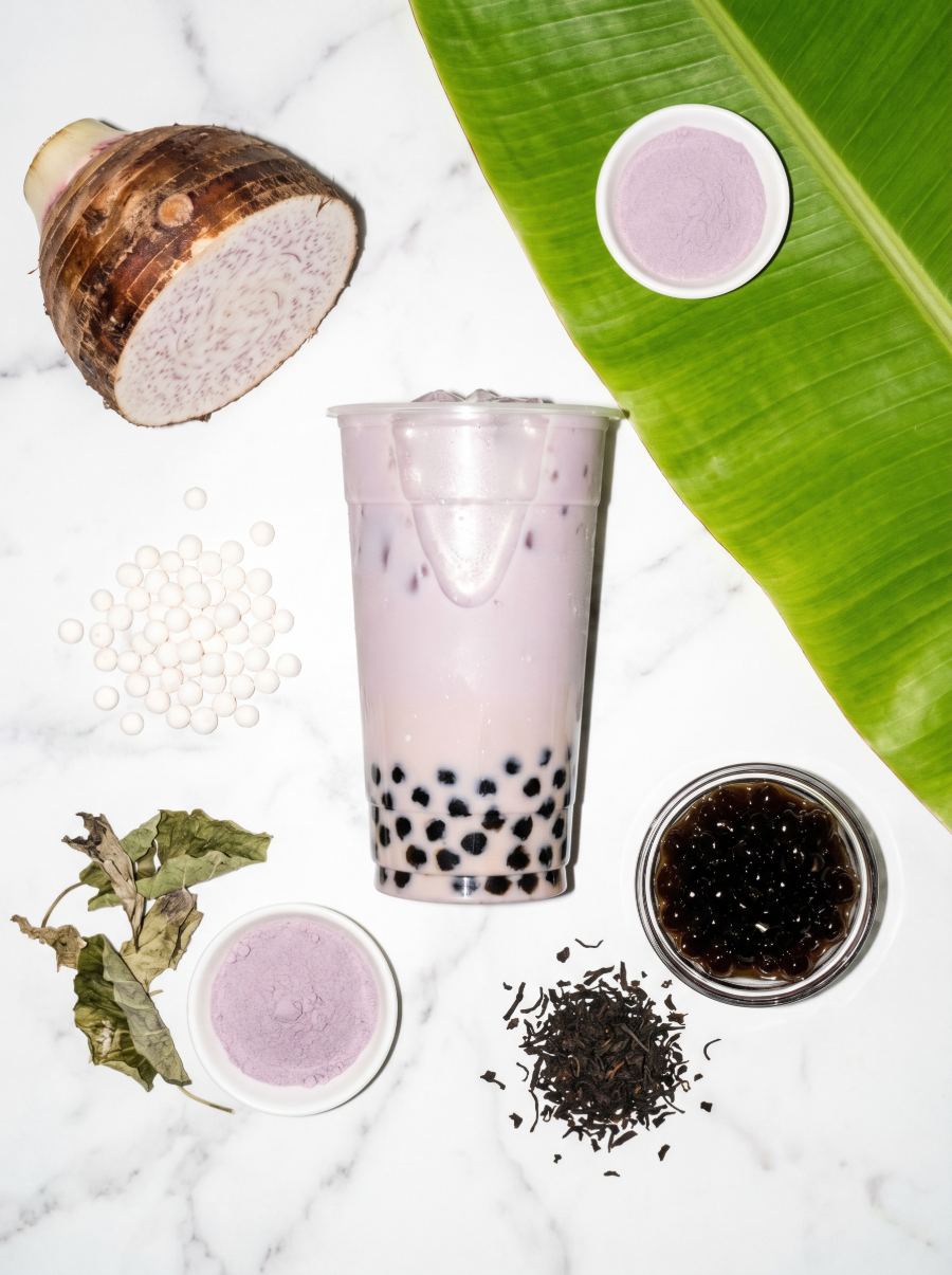 Taro Milk boba styled with taro root, tea leaves, and tapioca pearls